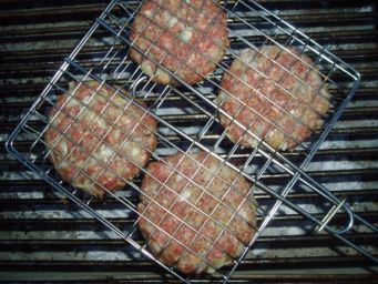 homemade burgers on a charcoal grill